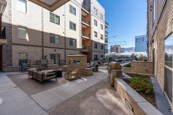 A patio area with furniture and a fire hydrant.
